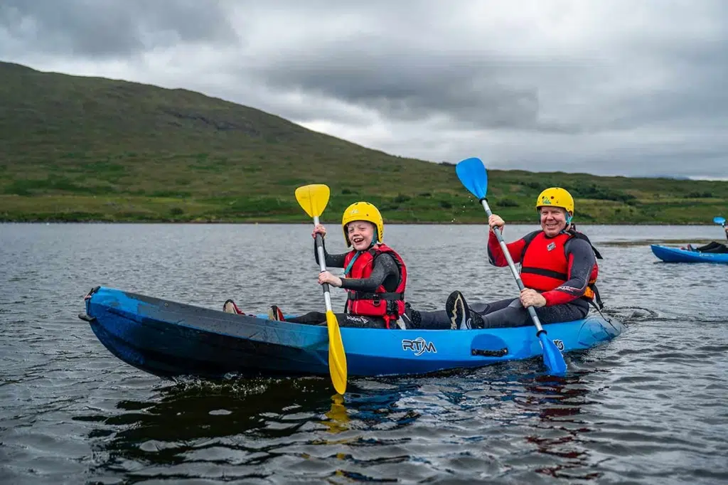 Dad and son kayaking