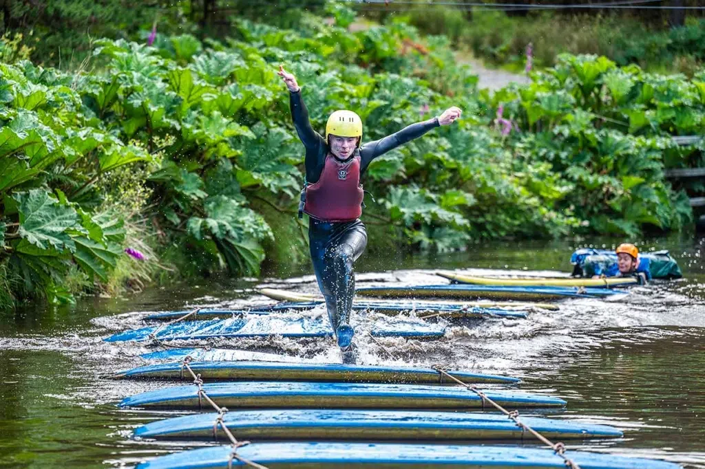 woman in bog obstacle course