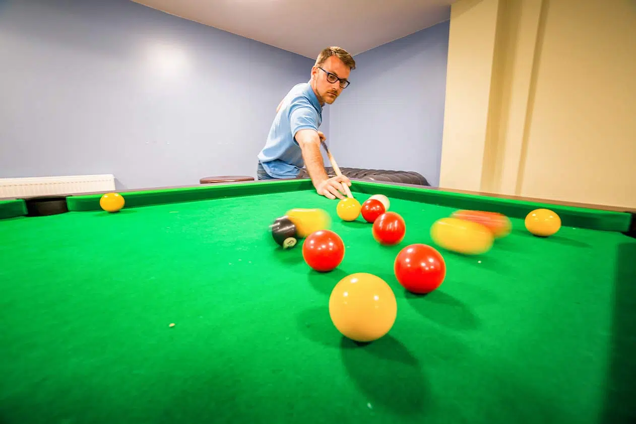 man playing billiard