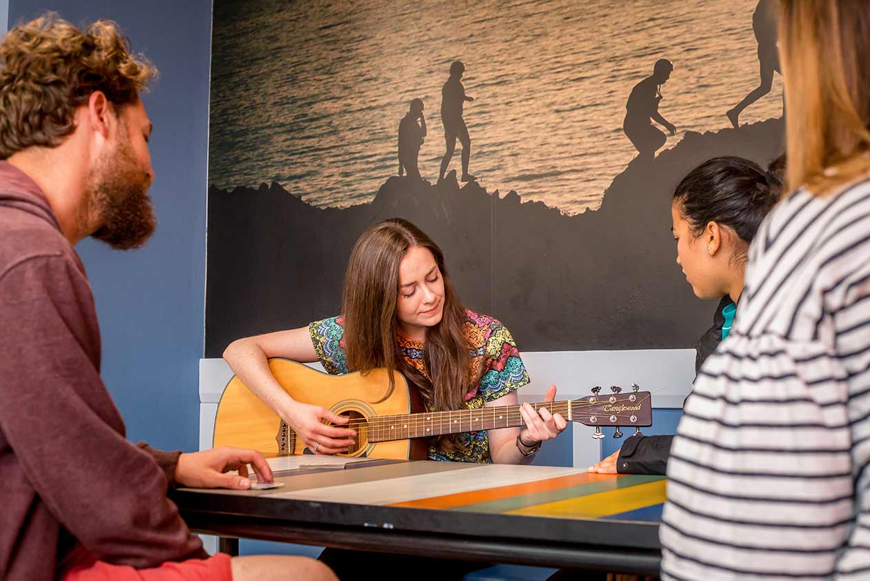 woman playing guitar