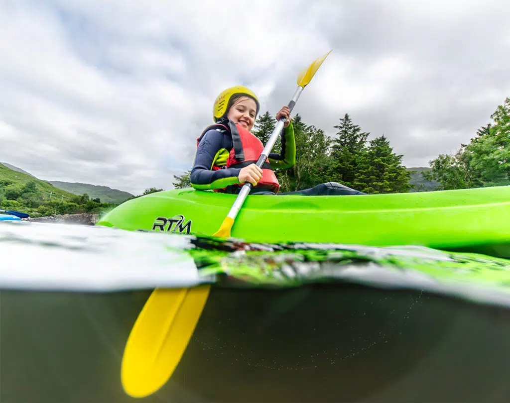 girl kakaking in the river - youth trip Ireland