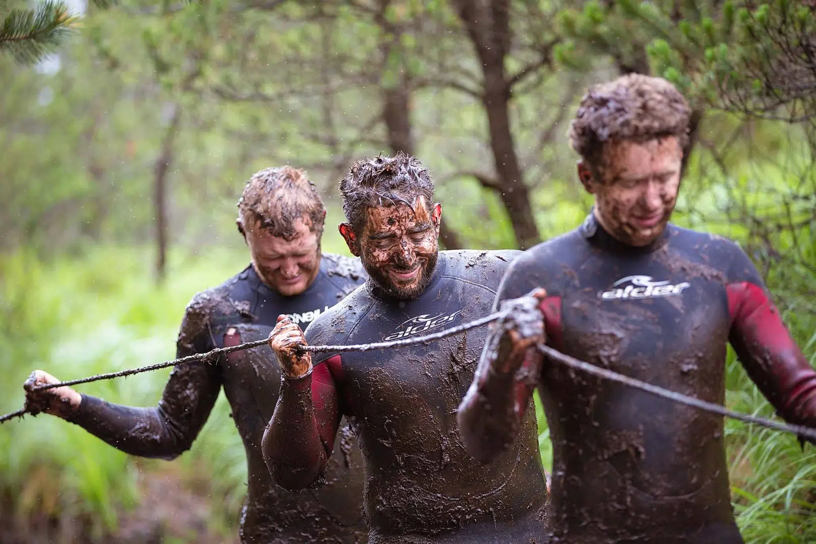 young men in mud for stag party in delphi