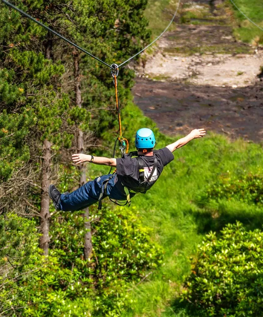 man in zip line - team building